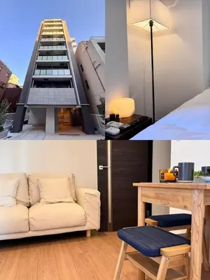 a living room with a couch and a staircase at Asakusa 601 Quad Room in Tokyo