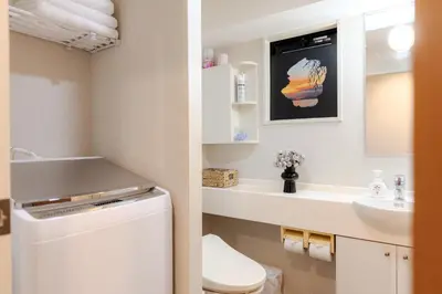 a bathroom with a toilet and a sink at Shinjuku-IEE in Tokyo