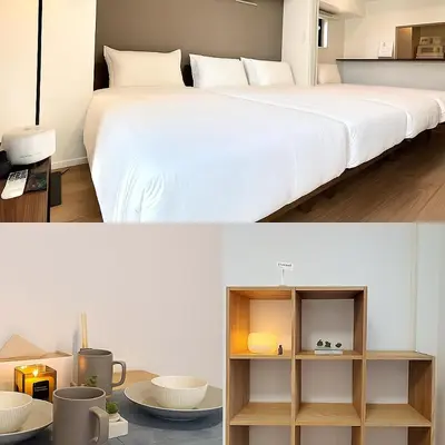 a bedroom with a large white bed and a table at Asakusa 401 Quad Room in Tokyo