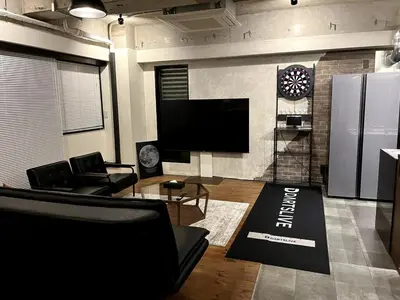 a living room with a flat screen tv and a couch at ebo\u7d30\u5de5\u753a3\u4e01\u76ee4F in Tokyo