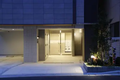 a hallway of a building at night at Asakusa 301 Quad room in Tokyo