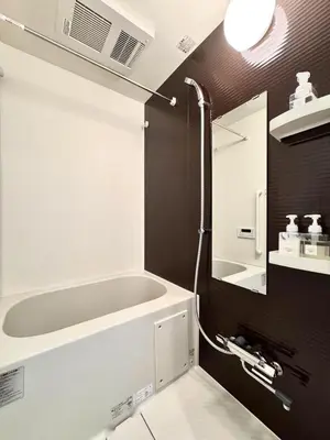 a bathroom with a bath tub and a sink at Asakusa 201 Quad room in Tokyo
