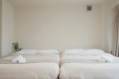 three mattresses are lined up in a room at Ikeda Ueno 301 Twin Room in Tokyo
