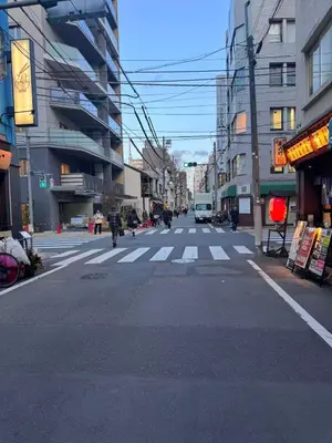 an empty street with a crosswalk in a city at Ikeda Ueno 401 Quad room in Tokyo
