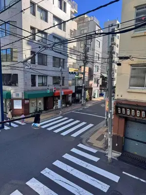an empty street with a crosswalk in a city at Ikeda Ueno 501 Quad room Room in Tokyo