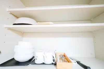 a shelf in a kitchen with some items on it at T akadababa subway 4 mins walk! Newly building \u65b0\u7bc9! \u9ad8\u7530\u99ac\u5834\u99c5 \u5f92\u6b69\u570f\u5185\u5927\u4eba\u6c17! Shinjuku\u65b0\u5bbf\u5708!\u9ad8\u901f\u65e0\u9650\u5236202 in Tokyo