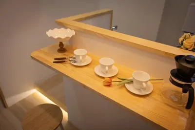 a wooden counter with two cups and saucers on it at Near Shinjuku,3LDK Mansion,3bedrooms,12 people in Tokyo