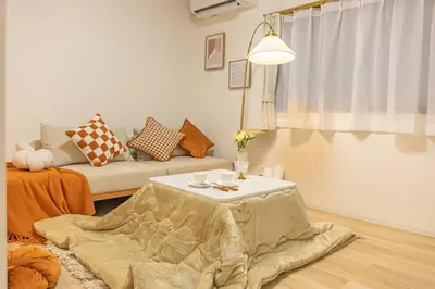 a living room with a table and a couch at Near Shinjuku,3LDK Mansion,3bedrooms,12 people in Tokyo