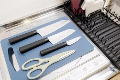 a bunch of knives sitting on a cutting board at Mi-HOTEL UENO in Tokyo