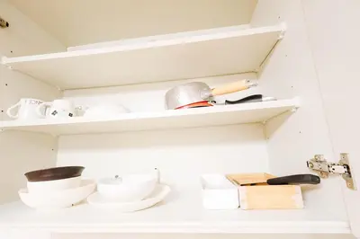 a kitchen with white shelves and white dishes at t akadababa subway 4 mins walk! Newly building \u65b0\u7bc9! \u9ad8\u7530\u99ac\u5834\u99c5 \u5f92\u6b69\u570f\u5185\u5927\u4eba\u6c17! Shinjuku\u65b0\u5bbf\u5708!\u9ad8\u901f\u65e0\u9650\u5236301 in Tokyo
