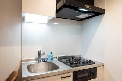 a kitchen with a sink and a stove at \u30aa\u30fc\u30af\u30ec\u30b9\u30c8\u6075\u6bd4\u5bff in Tokyo