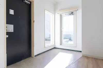 an empty room with a door and a window at DeLCCS\u8981\u753a in Tokyo