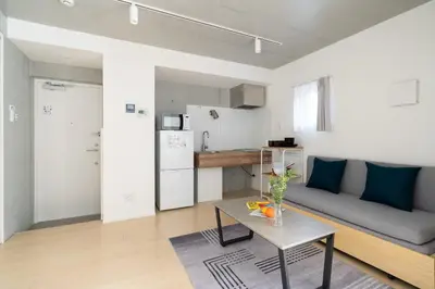 a living room with a couch and a table at Bel Avenir in Tokyo
