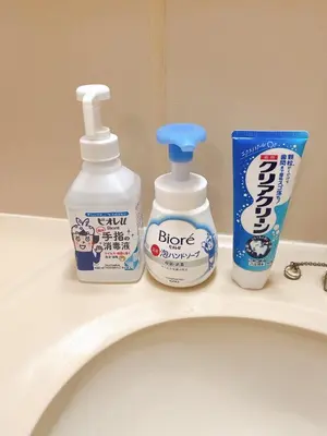 two bottles of cleaning products sitting on top of a sink at ToyamaHouse2-203 in Tokyo