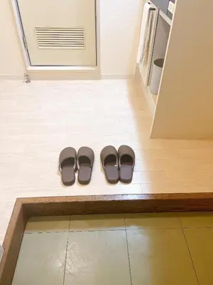 a pair of shoes sitting on a floor next to a door at ToyamaHouse2-203 in Tokyo