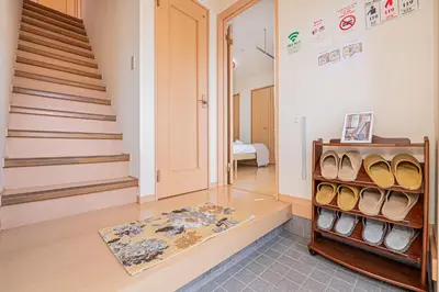 a hallway with a room with stairs and a door at Mori house\u738b\u5b50\u672c\u753a in Tokyo