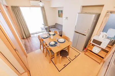 a small room with a table and a kitchen at Mori house\u738b\u5b50\u672c\u753a in Tokyo
