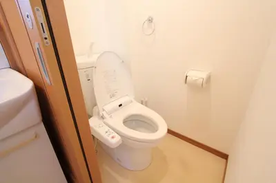 a small bathroom with a toilet in an airplane at HOTEL LUANA in NISHIKI in Tokyo