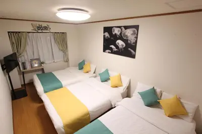 a bedroom with two beds at HOTEL LUANA in NISHIKI in Tokyo