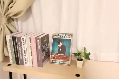 two books sitting on top of a shelf at HOTEL LUANA in NISHIKI in Tokyo