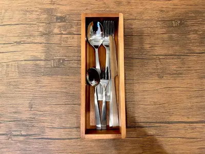a wooden box with utensils sitting on a table at Ikebukuro-Kanamecho Studio Comfortable&Central 2F in Tokyo