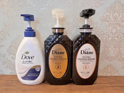 three bottles of detergents sitting on a wooden shelf at Ikebukuro-Kanamecho Studio Comfortable&Central 2F in Tokyo