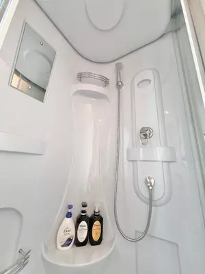 a bathroom with a shower with a toilet and a sink at Ikebukuro-Kanamecho Studio Comfortable&Central 2F in Tokyo