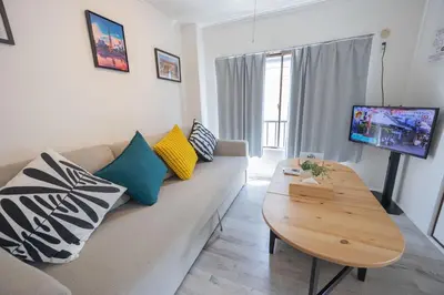 a living room with a couch and a table at shan-Nishiochiai 2F-SJ0005 in Tokyo