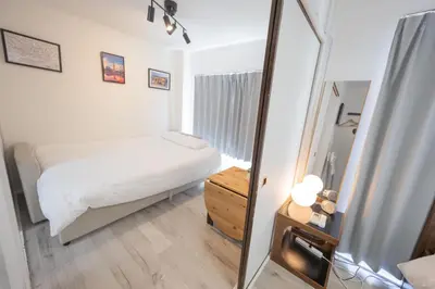 a small bedroom with a bed and a mirror at shan-Nishiochiai 2F-SJ0005 in Tokyo