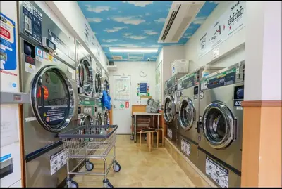 a laundry room with multiple washing machines in a store at shan-Nishiochiai 2F-SJ0005 in Tokyo
