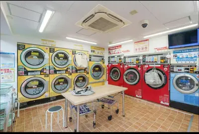 a laundry room with four washing machines and a table at shan-Nishiochiai 2F-SJ0005 in Tokyo