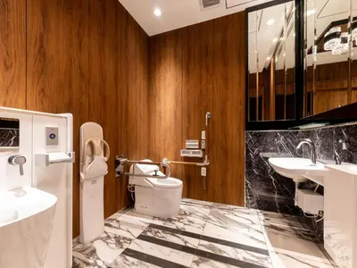a bathroom with a toilet and a sink at APA Hotel Suidobashi Ekimae in Tokyo