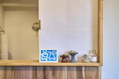 a shelf with some items on top of it at HOTEL HONjoy in Tokyo