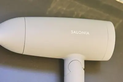 a close up of a white device with sa automation on it at HOTEL HONjoy in Tokyo