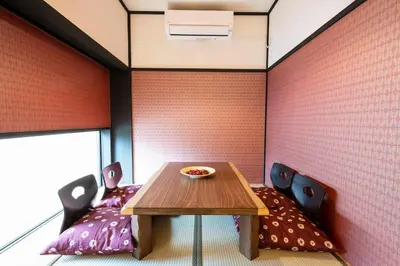 a dining room with a table and two chairs at 3 Mins from Skytree and Train Station, A Dream Retreat For 8 in Tokyo