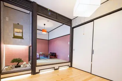 a room with a large window and a room with a table at 3 Mins from Skytree and Train Station, A Dream Retreat For 8 in Tokyo