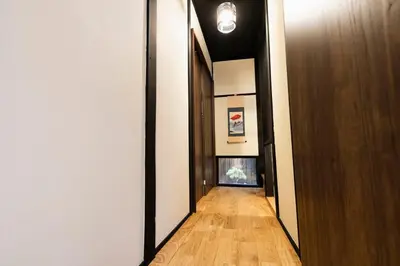 an empty hallway with a hallway at 3 Mins from Skytree and Train Station, A Dream Retreat For 8 in Tokyo