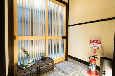 a room with a door and a window with aperature at 3 Mins from Skytree and Train Station, A Dream Retreat For 8 in Tokyo