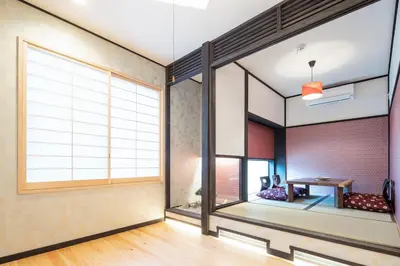 a room with a large window and a table at 3 Mins from Skytree and Train Station, A Dream Retreat For 8 in Tokyo