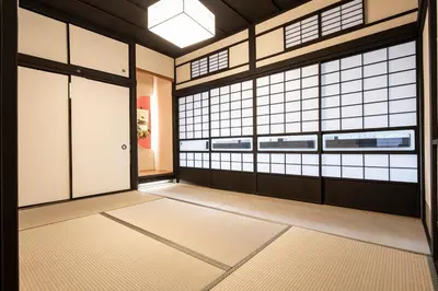 an empty room with a door and windows at 3 Mins from Skytree and Train Station, A Dream Retreat For 8 in Tokyo