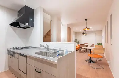 a kitchen with a sink and a dining room at \u6839\u5cb8\u6238\u5efa\u3066 in Tokyo