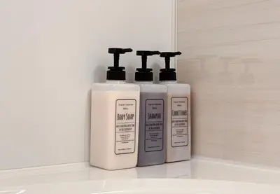 two bottles ofodorizers are sitting on a counter at \u6839\u5cb8\u6238\u5efa\u3066 in Tokyo