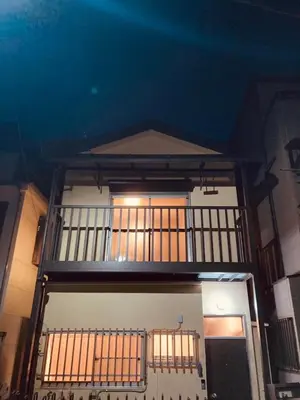 a building with a balcony on the top of it at Tokyo East Hotel in Tokyo