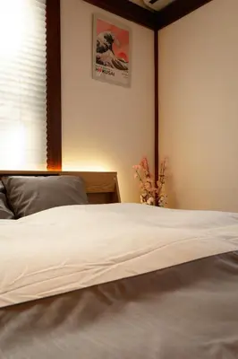 a bedroom with a white bed with a window at Tokyo East Hotel in Tokyo