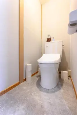 a bathroom with a white toilet in a room at Sumida Skytree hostel in Tokyo