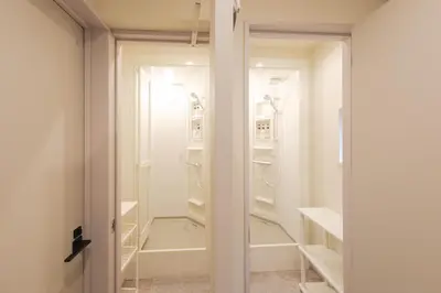 a walk in closet with a glass door at Make Your Hotel\u5e61\u30f6\u8c37 in Tokyo