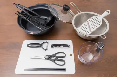 a table with a cutting board with scissors and a strainer at Ikebukuro Urban Retreat in Tokyo