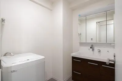 a bathroom with a toilet and a sink and a mirror at Teto\u65e9\u7a32\u7530 in Tokyo