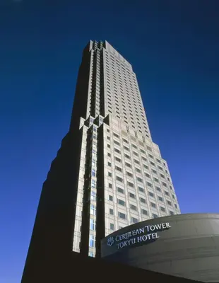 a tall white building with a sign in front of it at SHIBUYA Bright Modern 40sqm Apartment FAMILY FRIENDLY!! in Tokyo