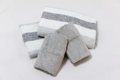 a group of three towels on a white background at SHIBUYA Bright Modern 40sqm Apartment FAMILY FRIENDLY!! in Tokyo
